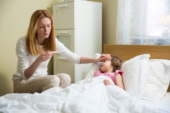 A mother caring for an ill child.