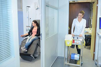 Phlebotomist approaching patient as part of our Boise, Garden City, Meridian, Nampa, Idaho Falls, Pocatello and Rexburg area Employee Wellness program.
