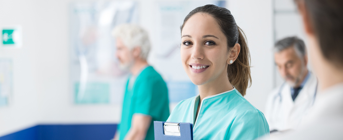 Young nurse holding chart in medical office.  Titer testing in Boise, Garden City, Meridian, Idaho Falls, Pocatello and Rexburg is available.