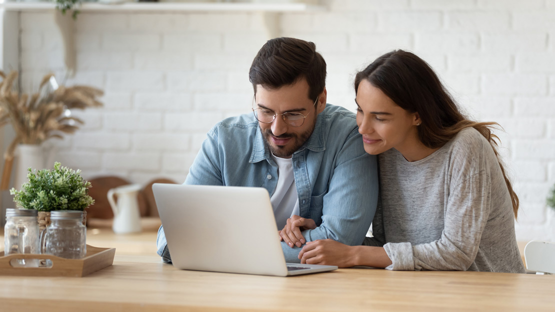 A young couple accessing the patient portal to receive medical laboratory reports from Express Lab, a medical laboratory, with draw site locations in Boise, Garden City, Meridian, Nampa, Pocatello, Idaho Falls and Rexburg.