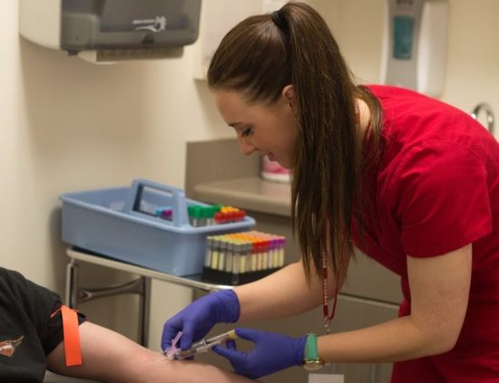 Phlebotomist doing blood draw in a laboratory draw site in one of our Boise, Garden City, Meridian, Nampa, Idaho Falls, Pocatello and Rexburg locations.