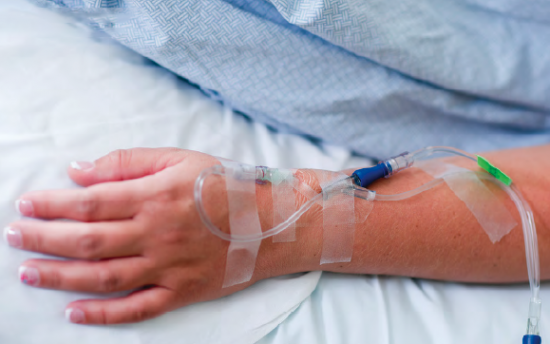 Patient's arm with working IV, a skill taught in our Phlebotomy School teaching medical laboratory services provided in Boise, Garden City, Meridian, Idaho Falls, Nampa, Pocatello and Rexburg 