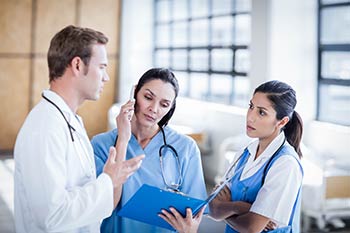 Physician talking with nurse ordering lab service in STAT status at one of our locations in Boise, Garden City, Meridian, Idaho Falls, Pocatello and Rexburg.